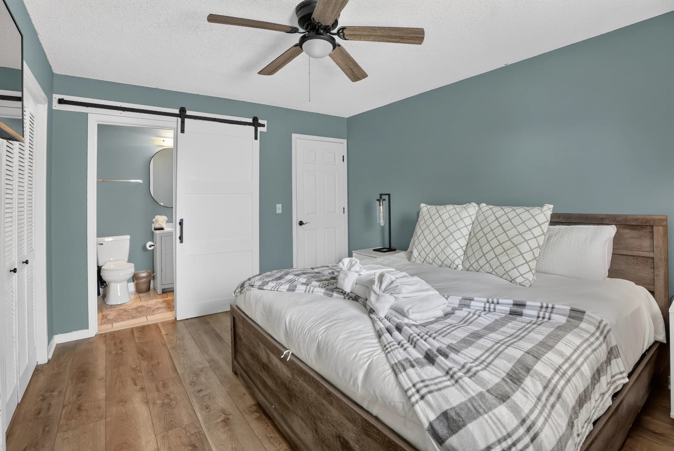 Furnished bedroom with adjoining bath at 6231 Rolling Fork Road Unit F